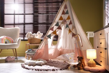Beautiful wigwam, cushions and toys in child's room © New Africa
