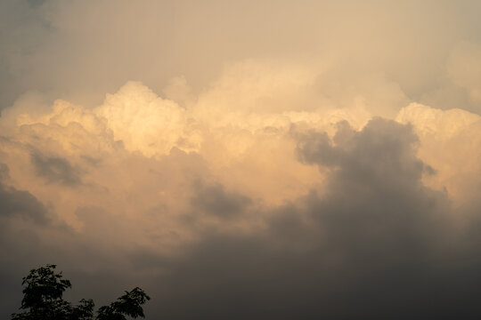 Dramatic clouds illuminated by the sun during sunset.