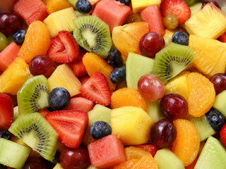 Obraz premium Healthy Colorful Mixed Fruit Salad Bowl Close-up