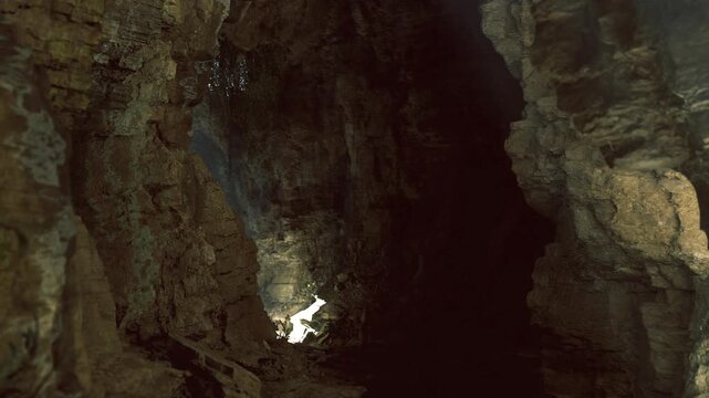 Hang son doong discovery shaft vista captures intense contrast between sunlit ledge and abyss, rough karst walls and damp moss patches, perfect backdrop