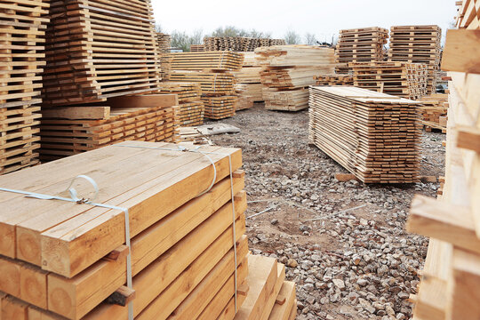 Manufacture of pallets made of wood for cargo transportation. Natural wood. Lumber warehouse. An open-air wood processing workshop. Woodworking