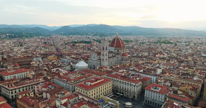 Florence aerial wide angle city square Piazza della Repubblica Duomo Tuscany Italy rooftop panorama drone dusk Renaissance urban landscape travel tourism slow motion Firenze overview