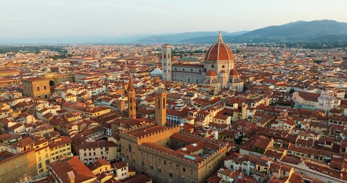 Florence aerial panorama Santa Maria del Fiore cathedral Duomo red rooftops Tuscany Italy drone dusk cityscape historic architecture travel tourism slow motion Renaissance city overview