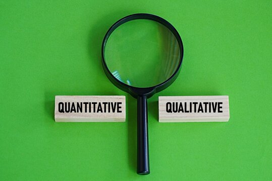 Quantitative qualitative printed wooden blocks. Education concept. Business. Data survey, related to words and meanings and number statistics