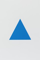 Fototapeta premium Azure Apex: Bold Blue Triangle Minimalist Design Art