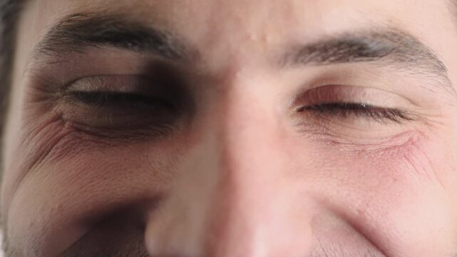 Face, eyes and man with smile for optometry, perception and correction of eyesight. Portrait, male person or retina with peripheral vision, iris examination and optical closeup for visual improvement