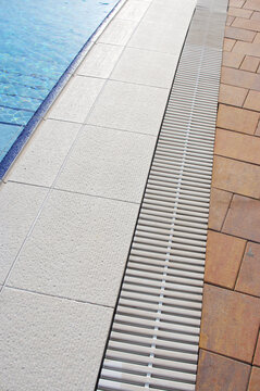 Swimming pool details in summer. Pool with clean water.