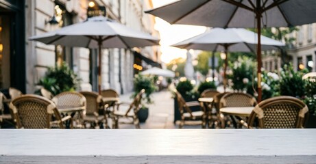 Obraz premium Outdoor Café Terrace with Umbrellas and Wicker Chairs for Web Design