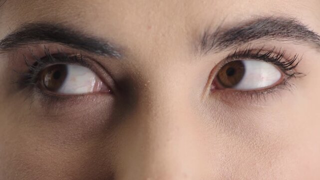 Face, eyes and person with closeup for optometry, perception and awareness for eyesight. Portrait, thinking and woman retina for peripheral vision, iris examination and optical care for visual health