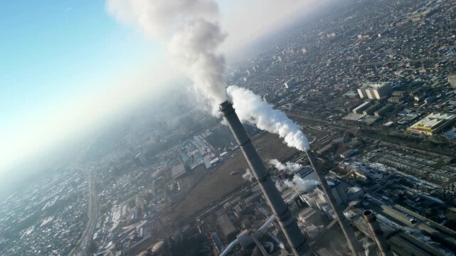 Bishkek thermal power station, smoke coming out of chimneys drone camera roll