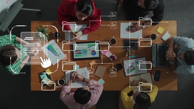 A diverse team collaborates in a modern office, engaged in creative discussions. Digital data visualization enhances their brainstorming process and productivity. Raster