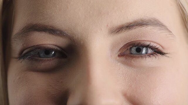 Face, eyes and woman with smile for optometry, perception and awareness for eyesight. Portrait, female person and retina with peripheral vision, iris examination and optical closeup for visual health