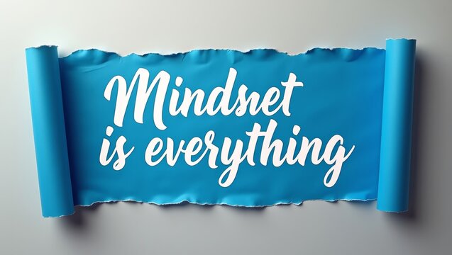 Blue torn paper banner with the phrase Mindset is everything in white cursive lettering, rolled edges creating a dynamic visual effect on a light background