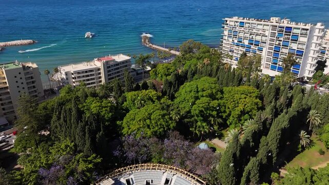 Marbella resort amphitheater gardens Mediterranean turquoise coastal 4K