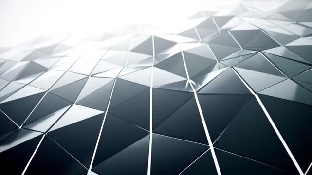 The animation shows the smooth, undulating movement of a series of three-dimensional triangles against a shiny, dark, metal or glass-textured surface.