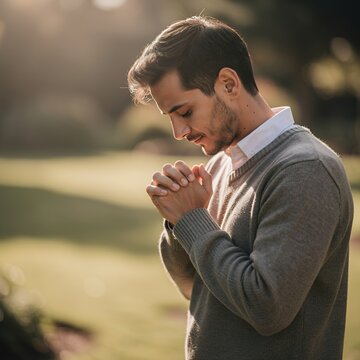 Man praying in the outdoors.