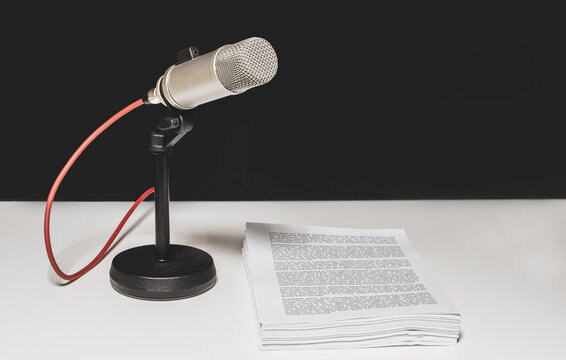 Studio microphone with script on desk