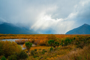 Obraz premium Tyndall light under the autumn clouds, Glenorchy, New Zealand