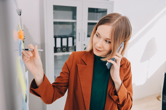Woman smiling to herself as she works in an office