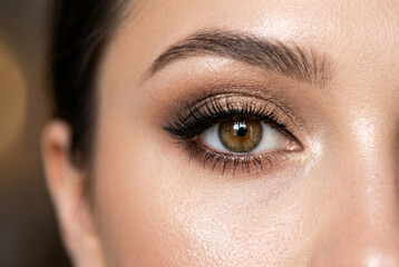 Naklejka premium Close-up of Woman's Eye with Makeup and Lashes