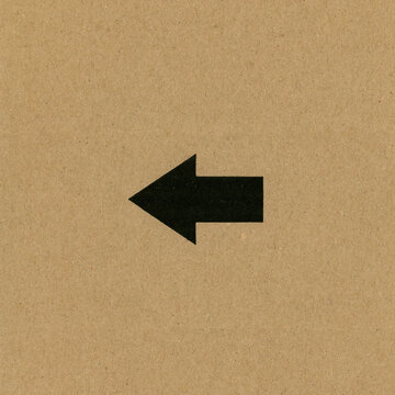 left arrow sign on cardboard