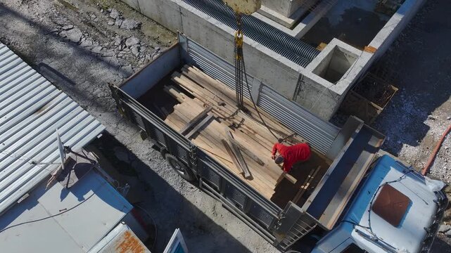 Aerial Video of Truck Full of Wooden Planks at Construction Area