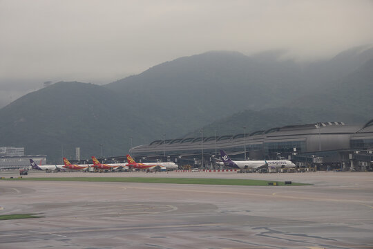 April 24 2026 Passenger Aircraft Parked At Terminal With Mountains