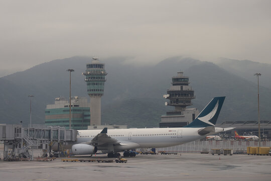 April 24 2026 Passenger Aircraft Parked At Terminal With Mountains
