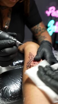 Captivating Process of a Tattoo Artist Crafting Intricate Geometric Designs on Skin with Precision and Expertise, Showcasing the Artistry of Body Modification