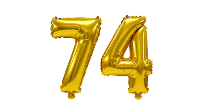 A close-up shot of shiny gold balloons displaying the number seventy four indoors.