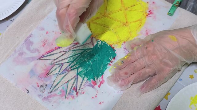 Stencil painting concept. Educational activity for children where they paint with colored paints. Creativity.	