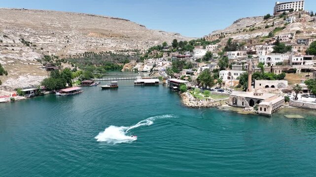 Drone Aerial View of Jet Ski Athlete Performing on the Halfeti River, May, 11, 2023, Sanliurfa, Halfeti, Turkiye