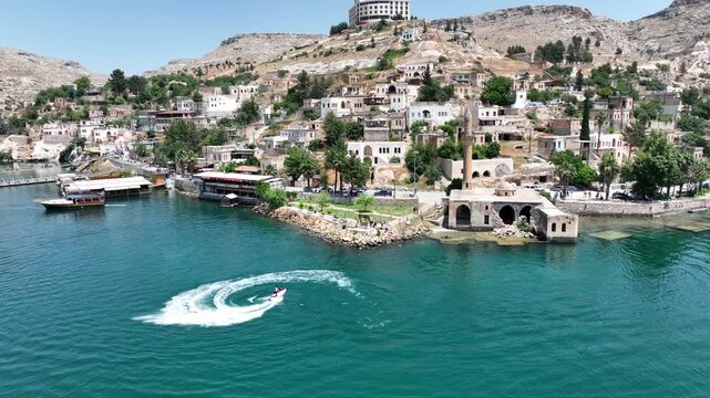Drone Aerial View of Jet Ski Athlete Performing on the Halfeti River, May, 11, 2023, Sanliurfa, Halfeti, Turkiye