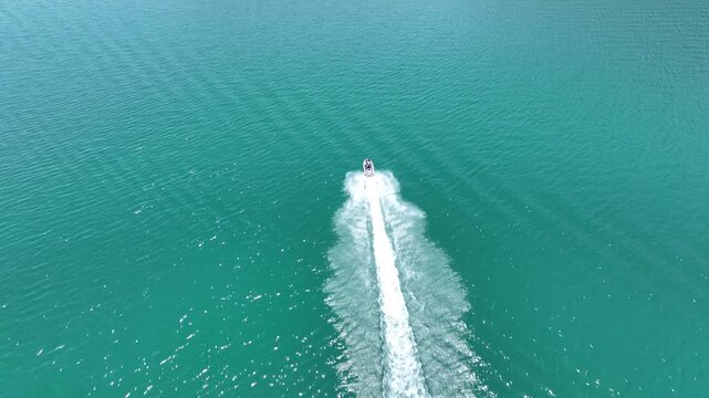 Drone Aerial View of Jet Ski Rider Speeding Across the River, May, 11, 2023, Sanliurfa, Halfeti, Turkiye