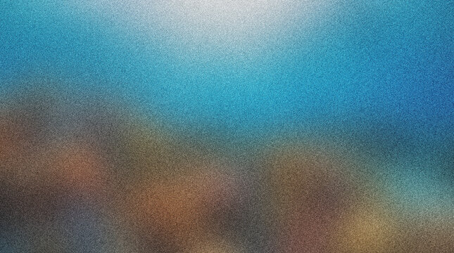 Blurry abstract landscape with blue sky and brown hills gradient colors