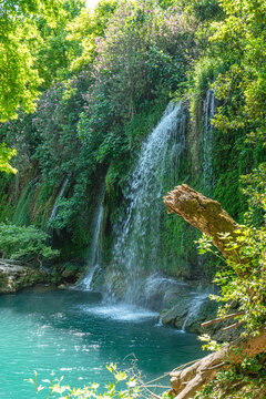 Scenic view of Kursunlu Waterfall and emerald water pond in Antalya nature park, Turkey.