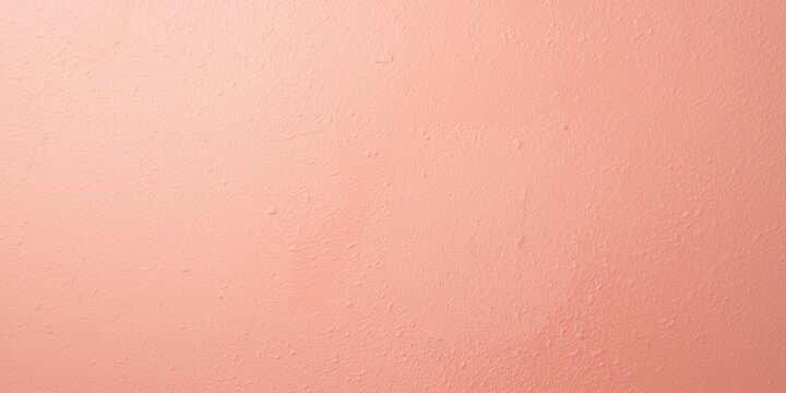 Soft daylight pastel coral textured backdrop with isolated lilly and copy space