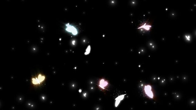 Colorful butterflies flying in slow motion against a dark background with sparkling lights
