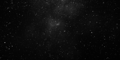 Obraz premium Stardust filled space in monochrome with twinkling stars and mysterious mood