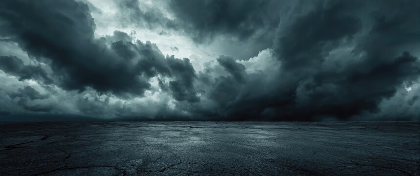 Heavy gray clouds in dramatic sky paired with textured dark concrete floor