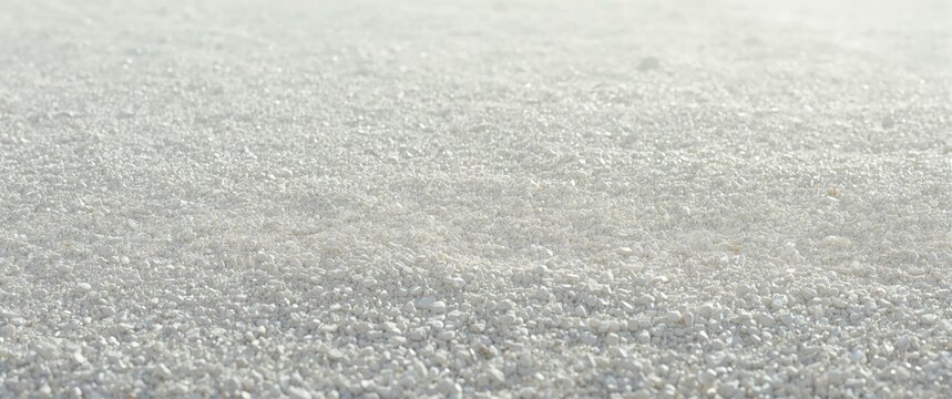 White gravel surface background with soft lighting and copy space