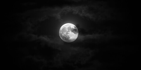Fototapeta premium serene full moon with mystical light in black and white