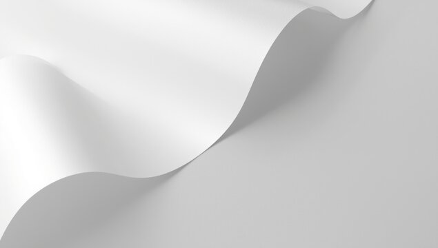 Natural light softly shining on curved white paper sheet against a smooth textured background copy space