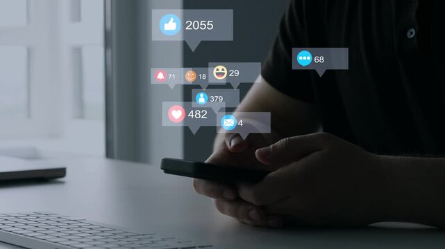 Man using smart phone with emoticon icons of Social Media.Interactive with friends on chat with emoticon feedback.Social media,marketing, like,social network,blog,live,chat reaction and livestream.	