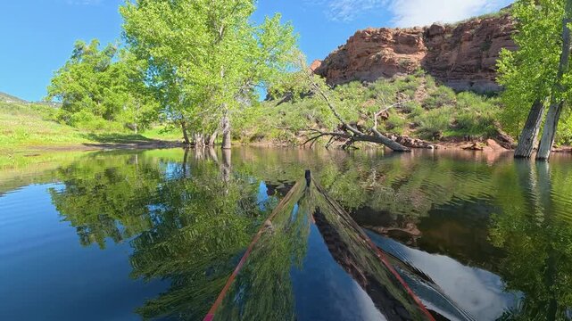 Immersive POV from a kayak - paddling on Horsetooth Reservoir in Fort Collins, Colorado, late spring scenery 