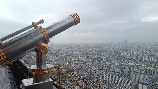 Telescope with raindrops on an observation deck with a panoramic view of Paris on a rainy day, eb01