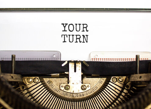 Your turn words symbol. Concept words Your turn typed on beautiful old retro typewriter. Beautiful white background. Business your turn motivational support concept. Copy space.