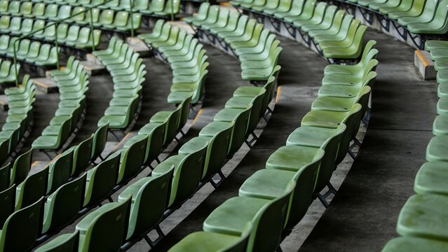Generative AI depicts an empty stadium with rows of green seats