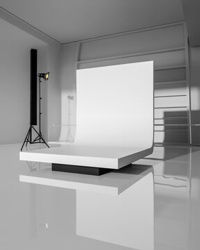 Black and white studio setup with a raised platform and lighting photography monochrome