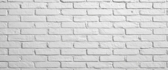 Fototapeta premium Unadorned white brick wall exhibiting a detailed sand grain surface effect